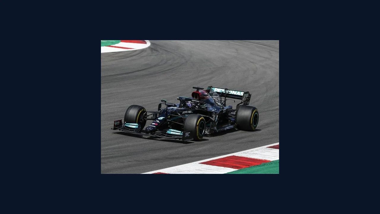 Formula 1 car speeding around a race track