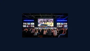 A sports bar wall of television screens showing sport
